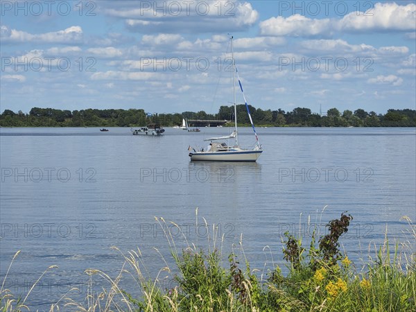 View of a lake with a sailing boat, Roermond, Netherlands