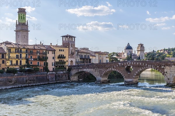 View of Verona historical city centre, Ponte Pietra bridge across Adige river, Verona Cathedral,