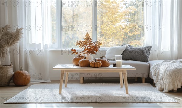 Scandinavian living room with a light wooden coffee table, white rug, autumn leaves centerpiece,