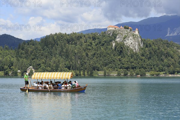 SLOVENIA, BLED, JULY 15, 2019: Traditional turist boat. Beautiful mountain lake in summer with