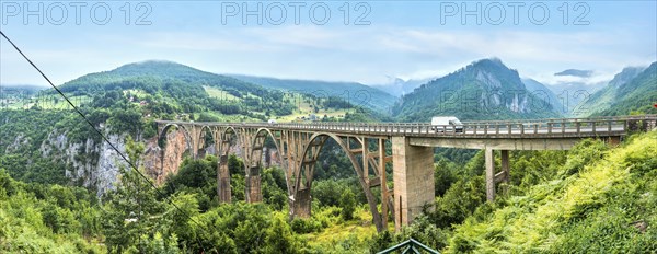 Panorama of Djurdjevica Bridge over river Tara on a cloudy day, Montenegro, Europe