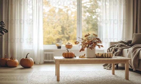 Scandinavian living room with a light wooden coffee table, white rug, autumn leaves centerpiece,