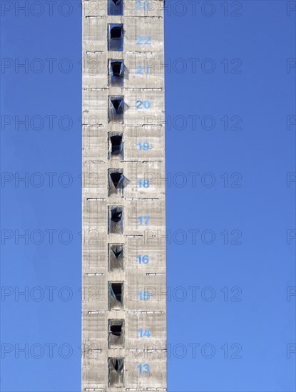 A tall concrete structure and service core of a new skyscraper building under construction with