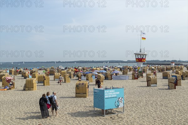Summer weather, bathers, beach chairs and DLRG lifeguard tower on the beach, Travemünde beach,