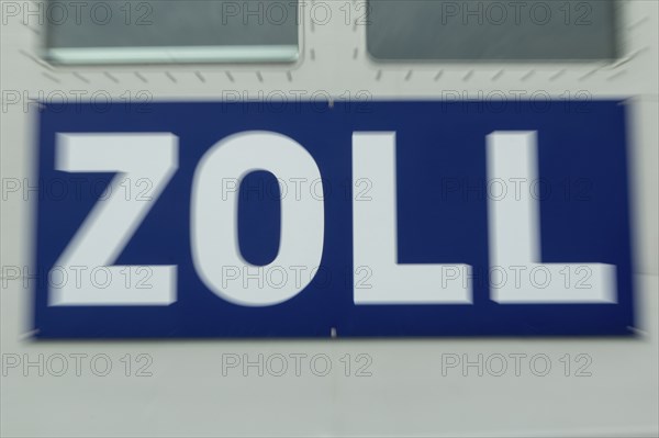 Close-up, sign with inscription customs at the customs boat Priwall in the harbour on the Priwall,