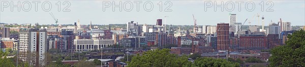 A wide panoramic view showing the whole of leeds city center with towers apartments roads and