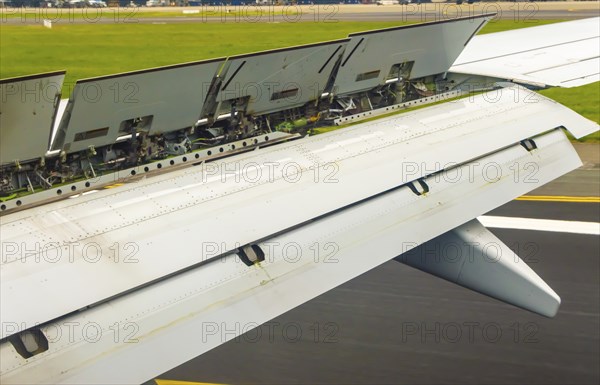 View of the spoiler uprising during a landing of an airliner at Brussels National Airport