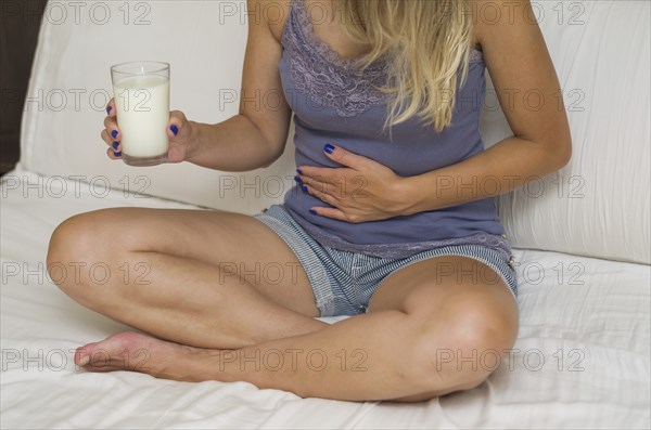 Great concept of food allergy, allergy to milk, lactose, bad woman with milk