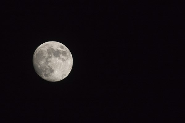 Waxing gibbous Moon, landscape orientated image with Moon isolated on black background with text or