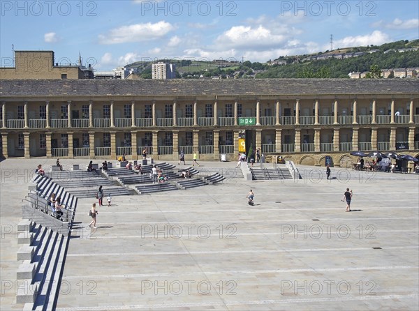 Halifax, west yorkshire, united kingdom, 23 july 2019: people relaxing on the steps and cafes and