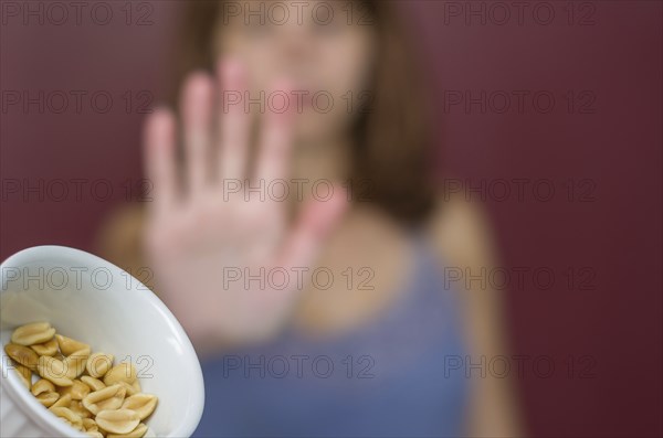 Great concept of food allergy, allergy to peanut, woman denying peanut