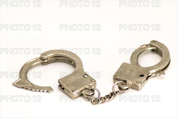 Pair of handcuffs close up front view on a white background