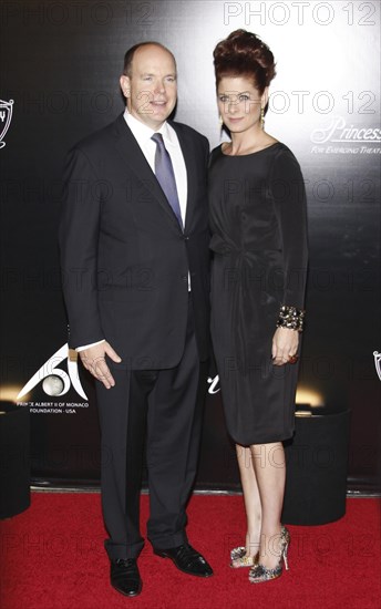 Prince Albert II of Monaco and Debra Messing at the Rodeo Drive Walk of Style Award honoring