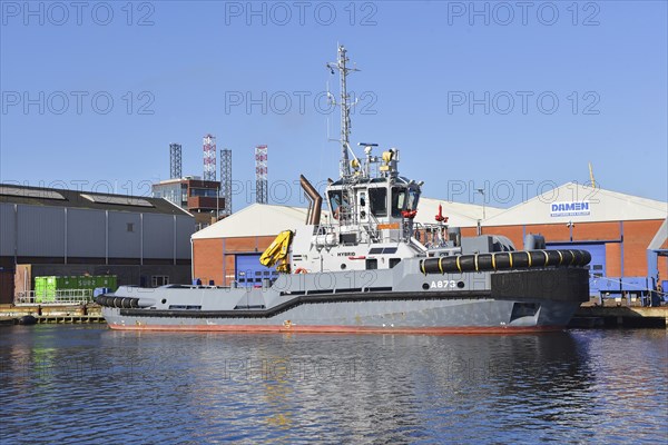 Den Helder, Netherlands. April 2023. A tug and an oil rig in Den Helder harbor