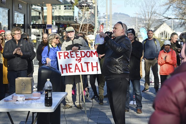 CHRISTCHURCH, NEW ZEALAND, JULY 24, 2021, A man speaks at a protest rally at the Bridge of