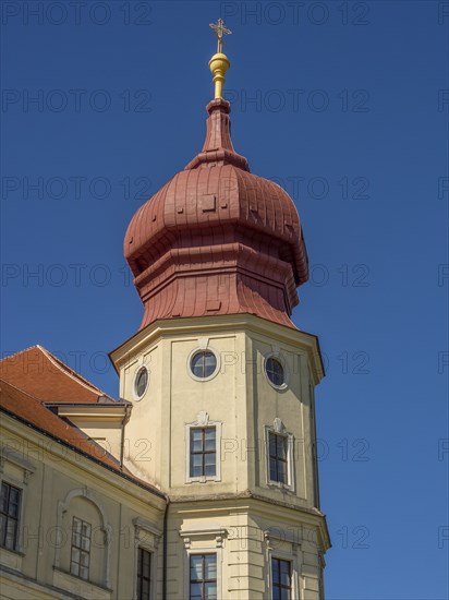 Baroque tower with red roof under a bright blue sky, Dürnstein, Wachau, Danube, Austria, Europe