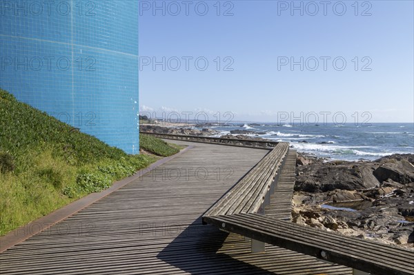 Passadiço das Ondas boardwalk, rocks and surf on the beach promenade in Nevogilde, Norte region,
