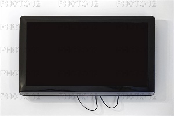 Black lcd TV set at wall
