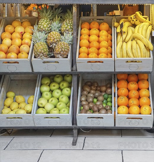 Crates with fresh fruits in juice bar