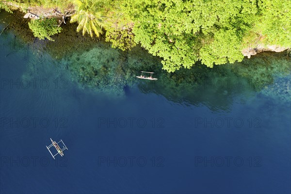 Inhabitants with outrigger boats, Tufi, Cape Nelson, Papua New Guinea, Oceania