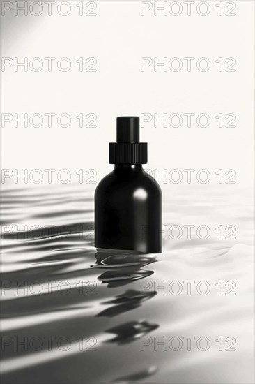 A black bottle floating in calm, reflective water with a minimalistic white background, AI