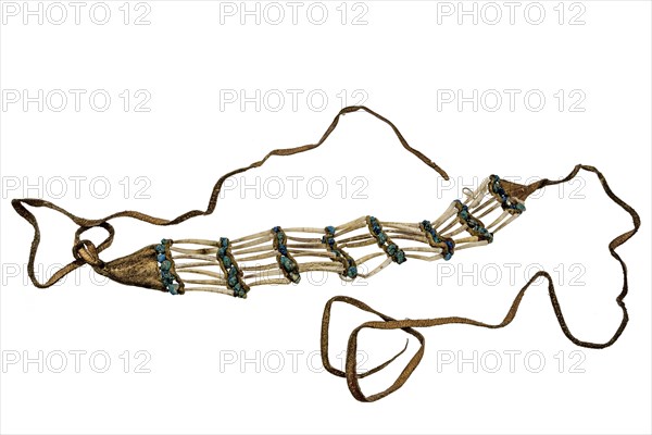Indian necklace made from shells, turquoises and leather strips on a white background
