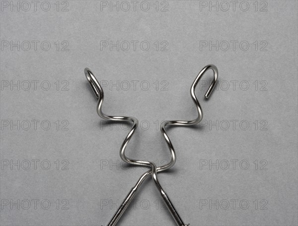 Two kneading hooks on grey background