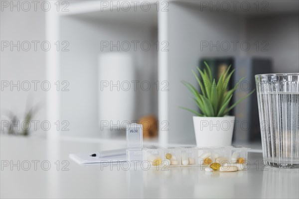 Closeup of medical pill box with doses of tablets for daily take a medicine for treatment, cure the