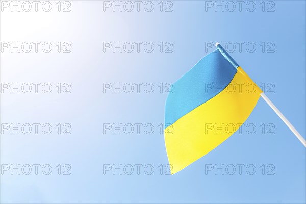 Large bicolor yellow blue Ukrainian state flag, national symbol fluttering, waving in wind against