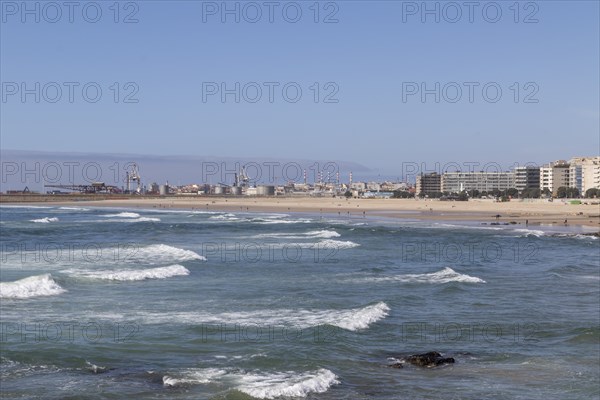 City view with surf in the Atlantic Ocean at Praia de Matosinhos beach in Matosinhos, Norte region,