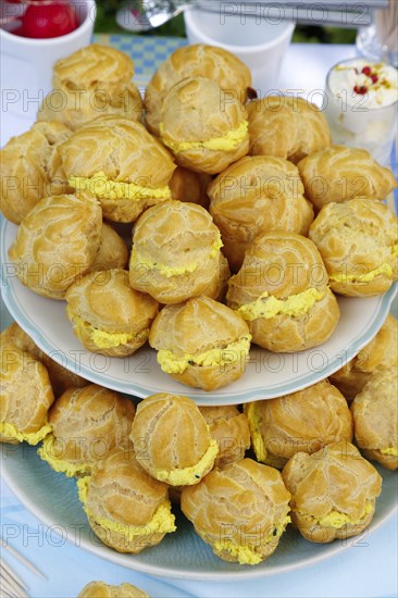 Swabian cuisine, mini cream puffs filled with goat's cream cheese, cream cheese éclairs,