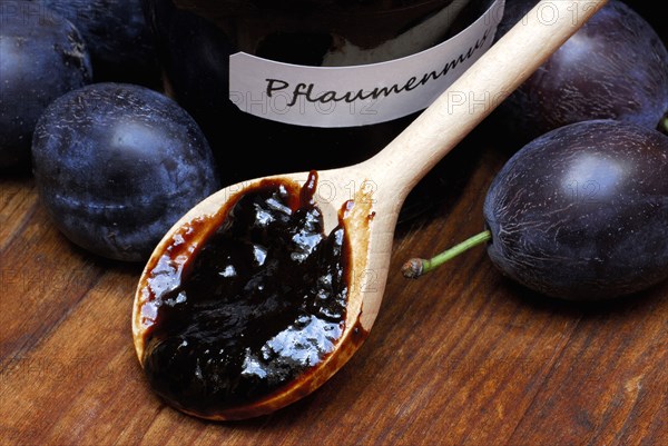 Plum jam in jar and plums, plum, plum plum, plum plum, plum, spoon, wooden spoon