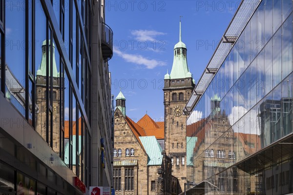 View through Bretgasse to the town hall with the reflection in Galeria Kaufhof