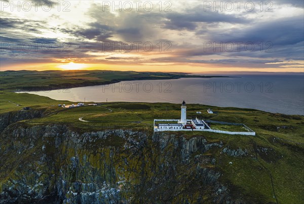 Sunset over Mull of Galloway Lighthouse from a drone, Mainland Scotland, Scotland, UK