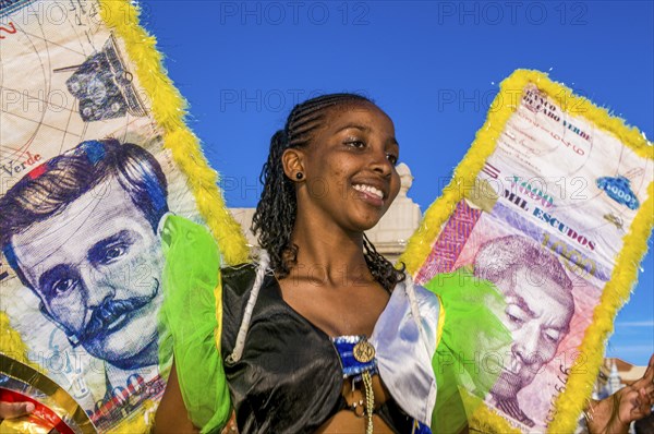 Colourful costumed, pretty women are dancing. Carnival. Mindelo. Cabo Verde. Africa