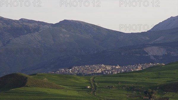 Mountains, green hillsides, city, lush green meadows, Madonie National Park, spring, Sicily, Italy,