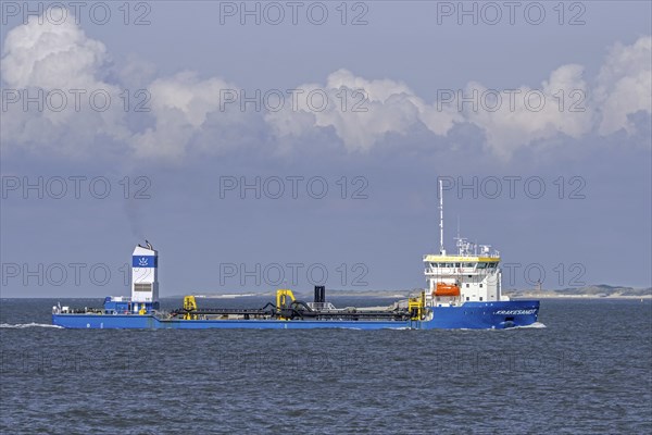 Trailing suction hopper dredger, TSHD Krakesandt sailing the Western Scheldt, Westerschelde along