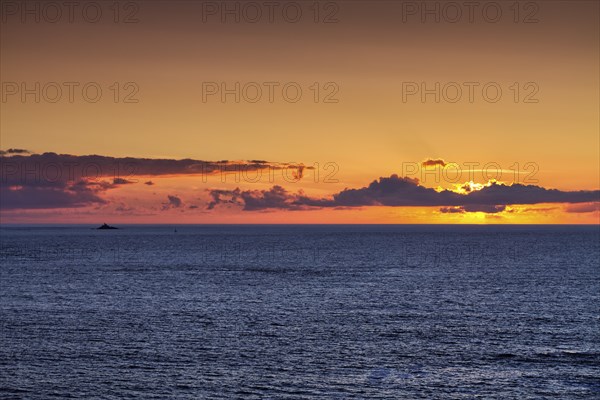 Sunset behind clouds on the Atlantic Ocean, Pointe du Van, Cap Sizun Peninsula, Département