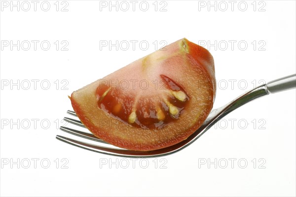 Tomato (Solanum lycopersicum) Kumato on fork