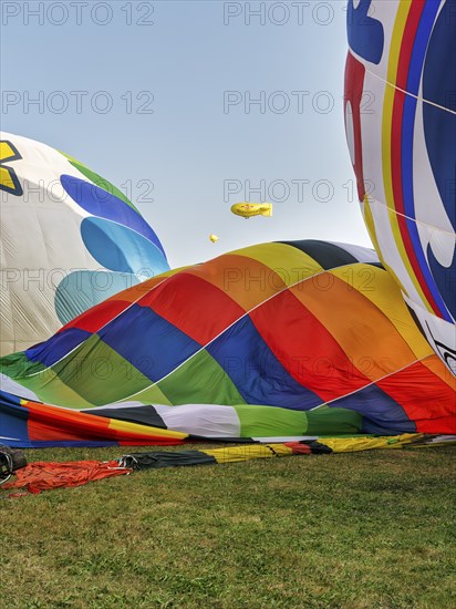 Hot air balloons on the ground, preparation for mass launch, Hot Air Balloon Festival, Warsteiner