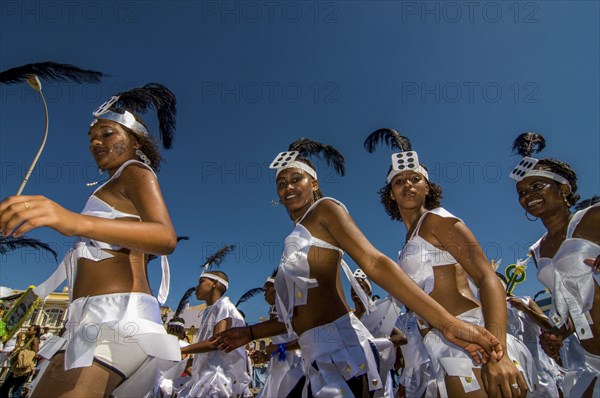 Colourful costumed, pretty women are dancing. Carnival. Mindelo. Cabo Verde. Africa