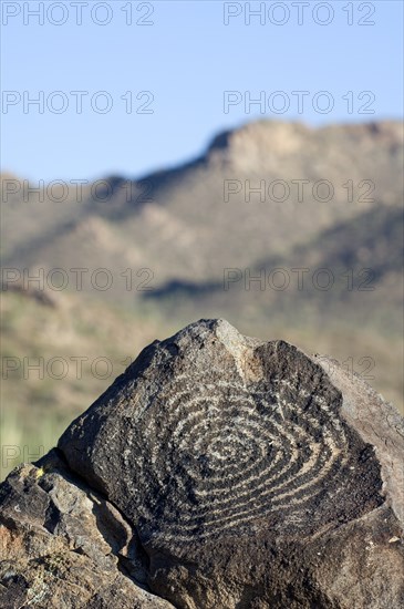 Rock art at Signal Hill, created by the Hohokam Indians, showing spiral petroglyph with the Tucson