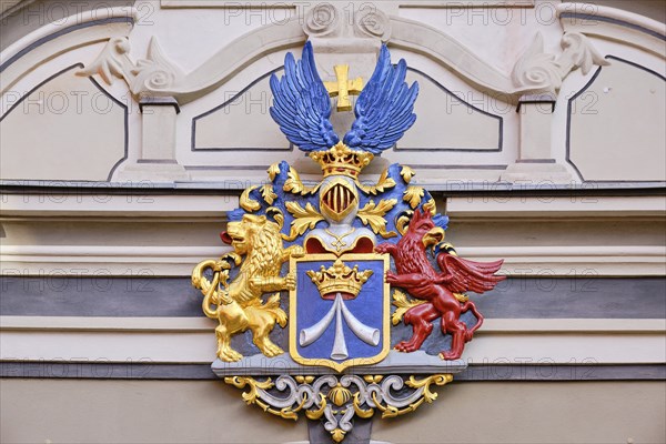 The town coat of arms from the Swedish occupation period on the gable of the baroque grand portal