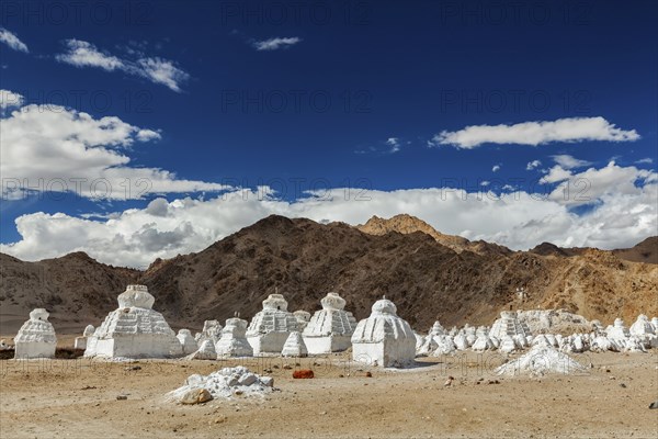 Whitewashed chortens (Tibetan Buddhist stupas) . Ladakh, Jammu and Kashmir, India, Asia