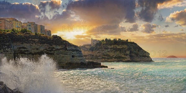 Coastal view of the old town of Tropea on sandstone cliffs and the medieval church Santuario di