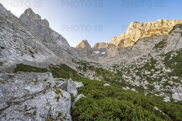 Rocky mountain peaks Schärtenspitze, Blaueisspitze and Hochkalter at sunrise, mountain tour on the