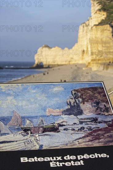 Painting by Claude Monet of fishing boats and the Porte d'Amont, a natural arch in the chalk cliffs