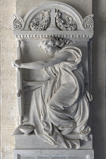 Sculpture of a woman with a ship's steering wheel, Monumental Cemetery, Cimitero monumentale di