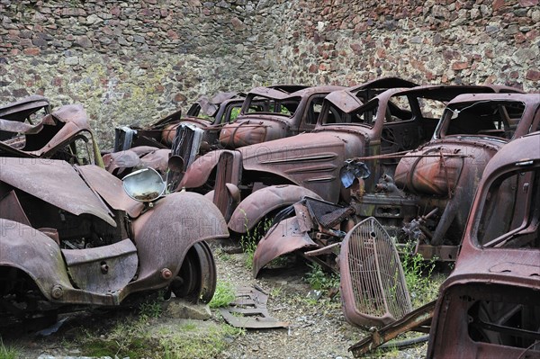 Burnt-out cars in the garage. The burnt village of Oradour-sur-Glane was destroyed on 10 June 1944
