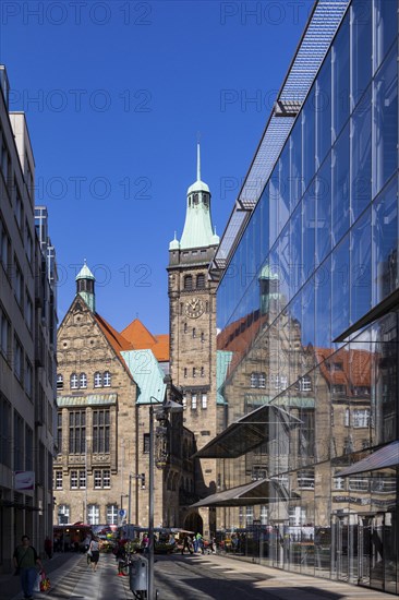View through Bretgasse to the town hall with the reflection in Galeria Kaufhof